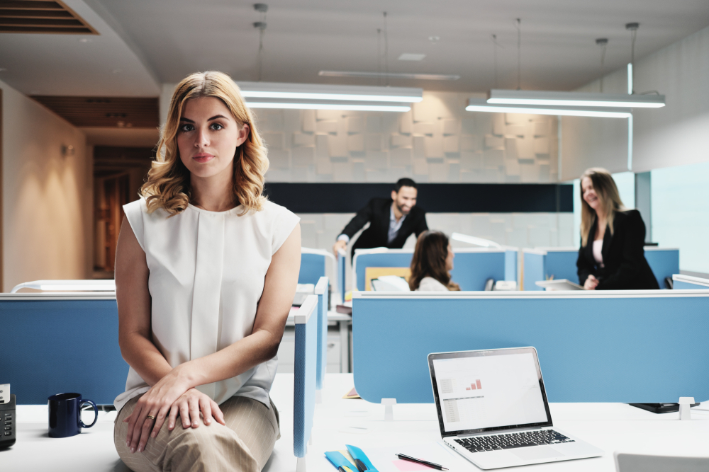 Portrait,Of,Serious,Female,Employee,Excluded,By,Colleagues.,Blonde,Businesswoman